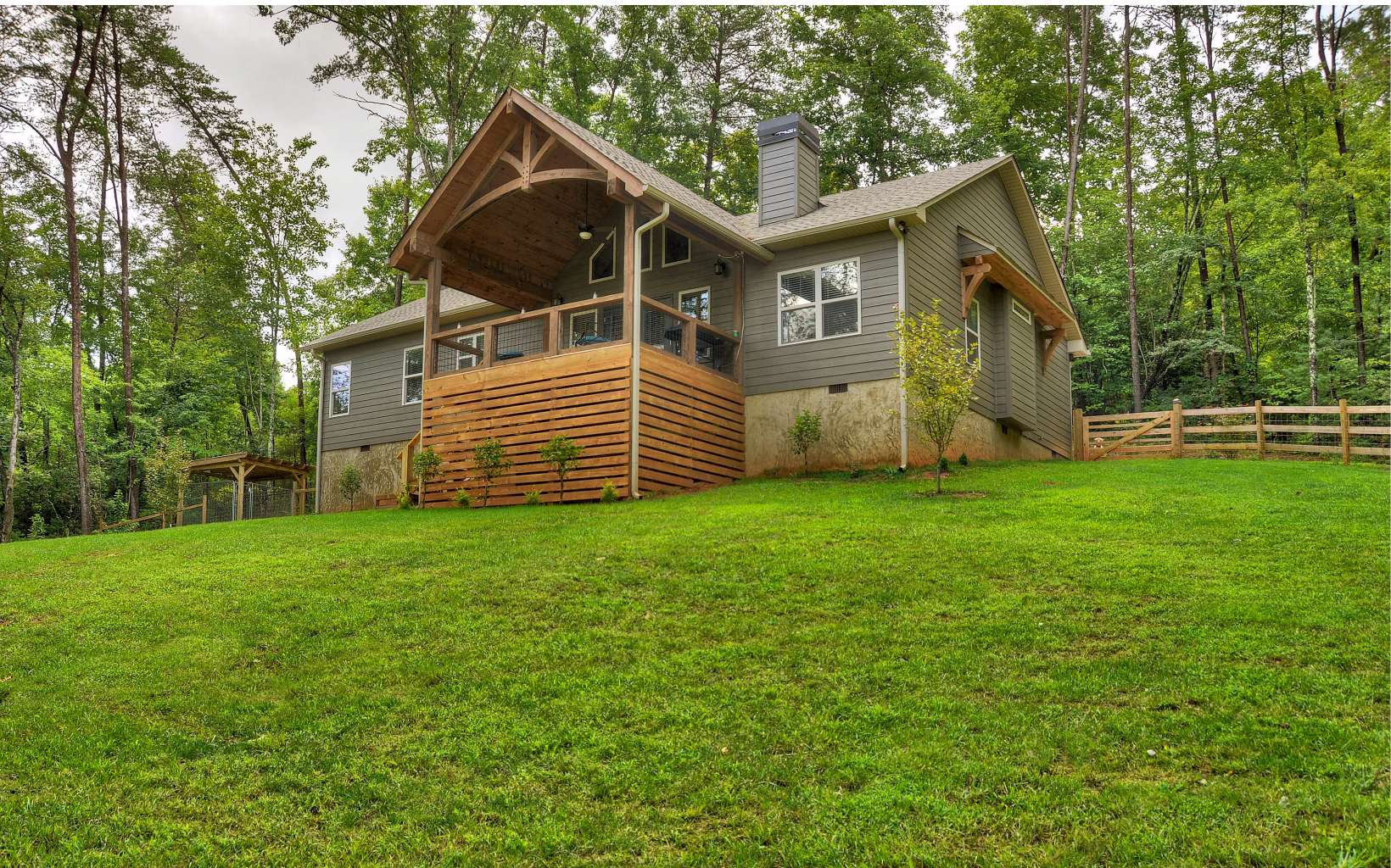 2289 Bullen Gap Road Blue Ridge, GA 30513 - Photo 1 of 1 a front view of a house with a yard and trees