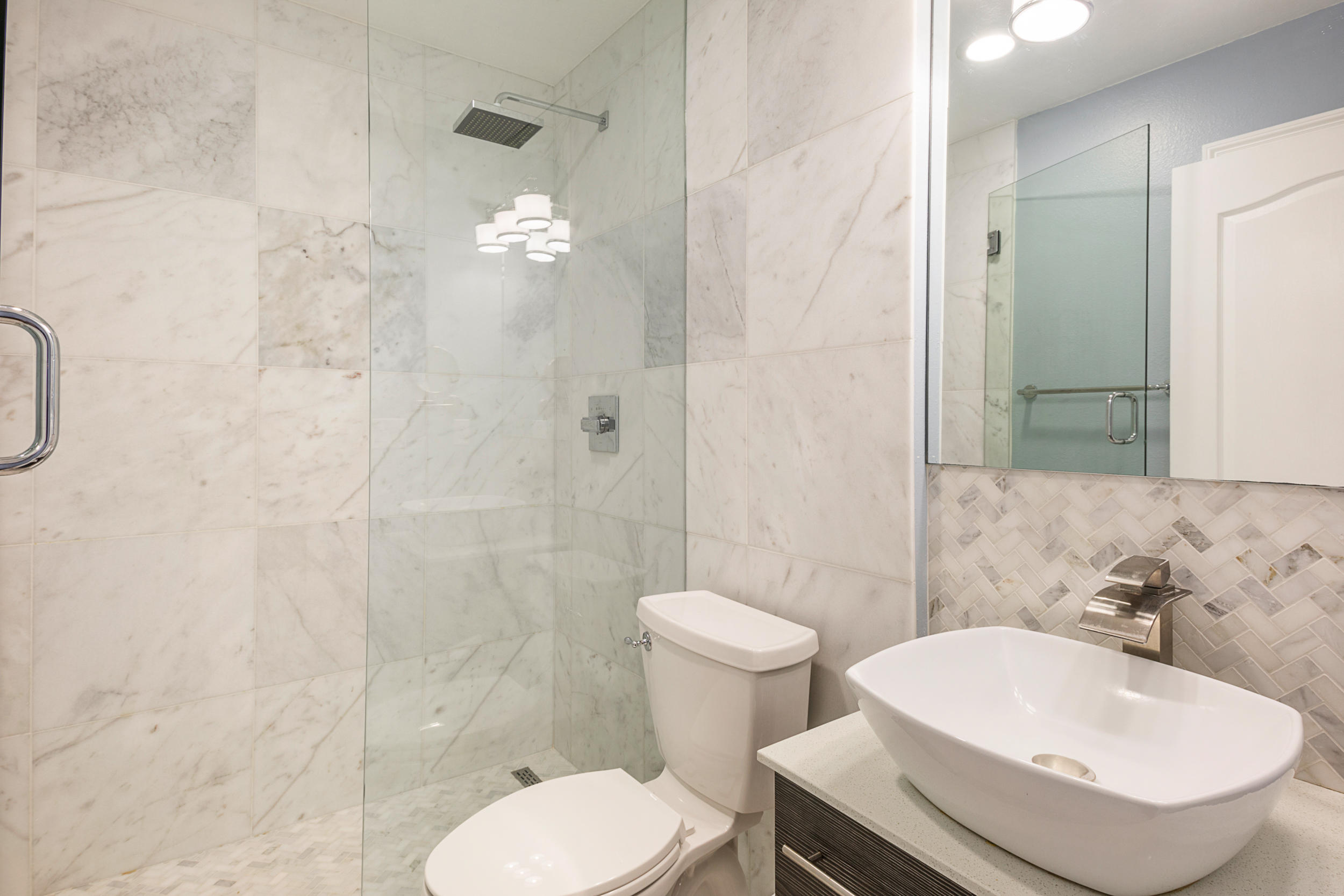 5975 Jack Stokes Road Baker, FL 32531 - Photo 15 of 44 a bathroom with a sink toilet and shower