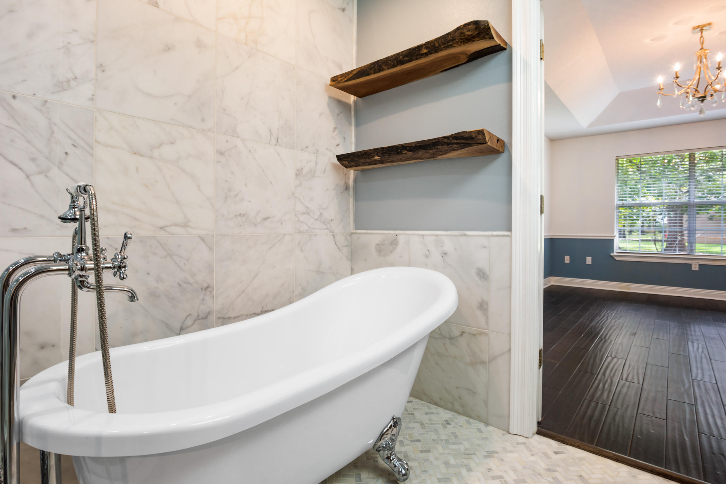 5975 Jack Stokes Road Baker, FL 32531 - Photo 24 of 44 a bathroom with a sink and a bathtub