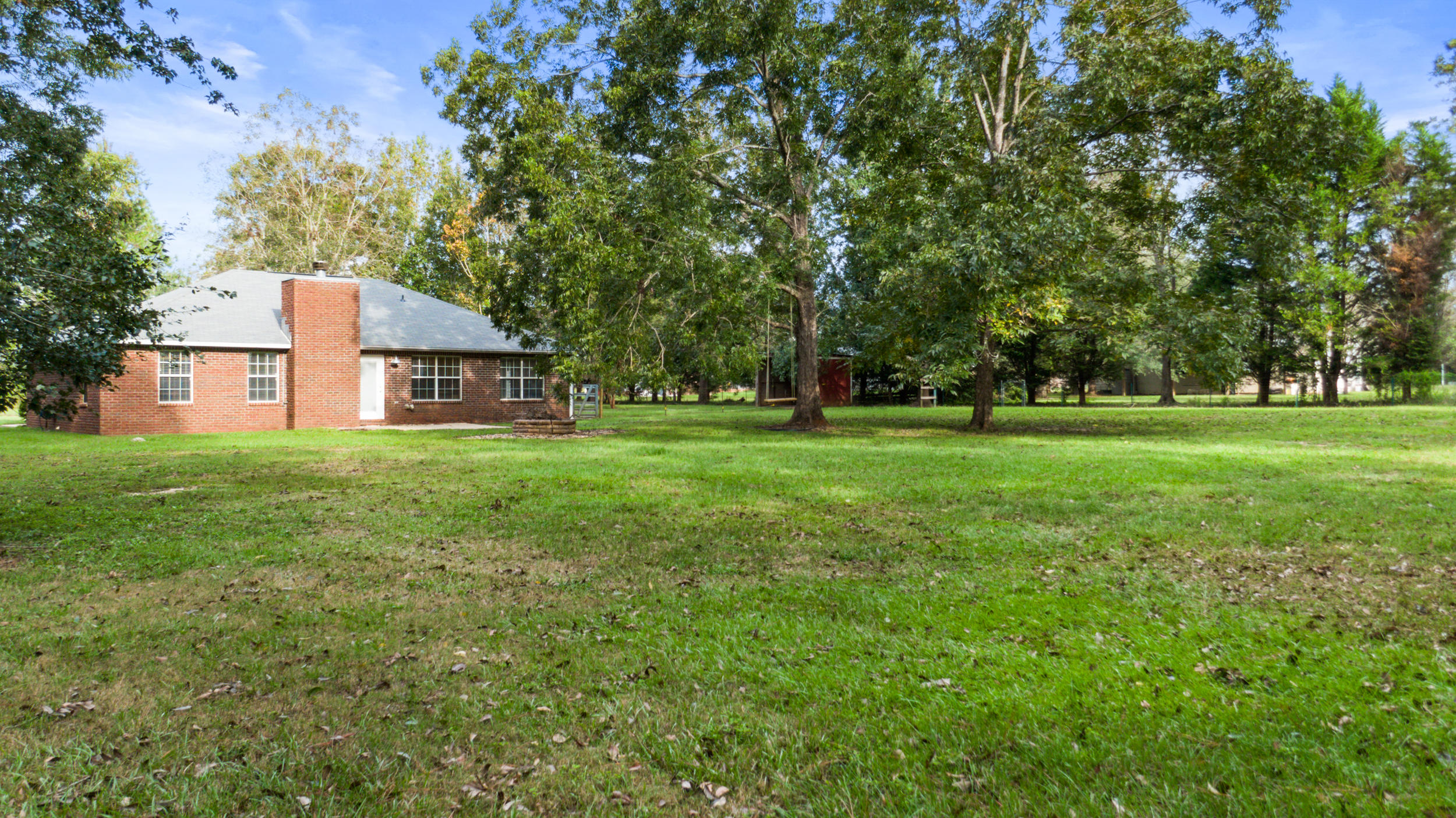 5975 Jack Stokes Road Baker, FL 32531 - Photo 31 of 44 a house view with a garden space