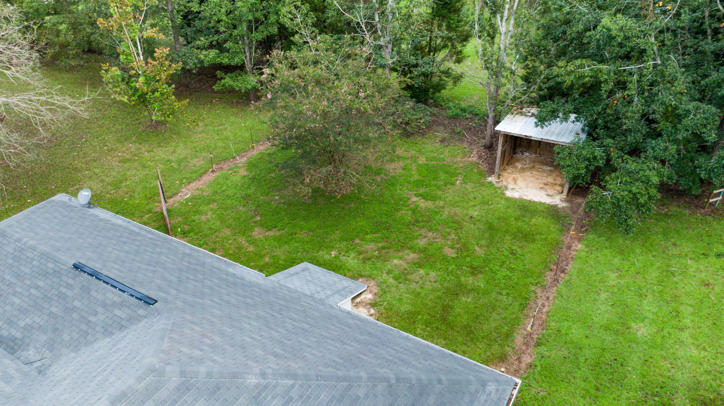 5975 Jack Stokes Road Baker, FL 32531 - Photo 32 of 44 a view of a backyard with a garden