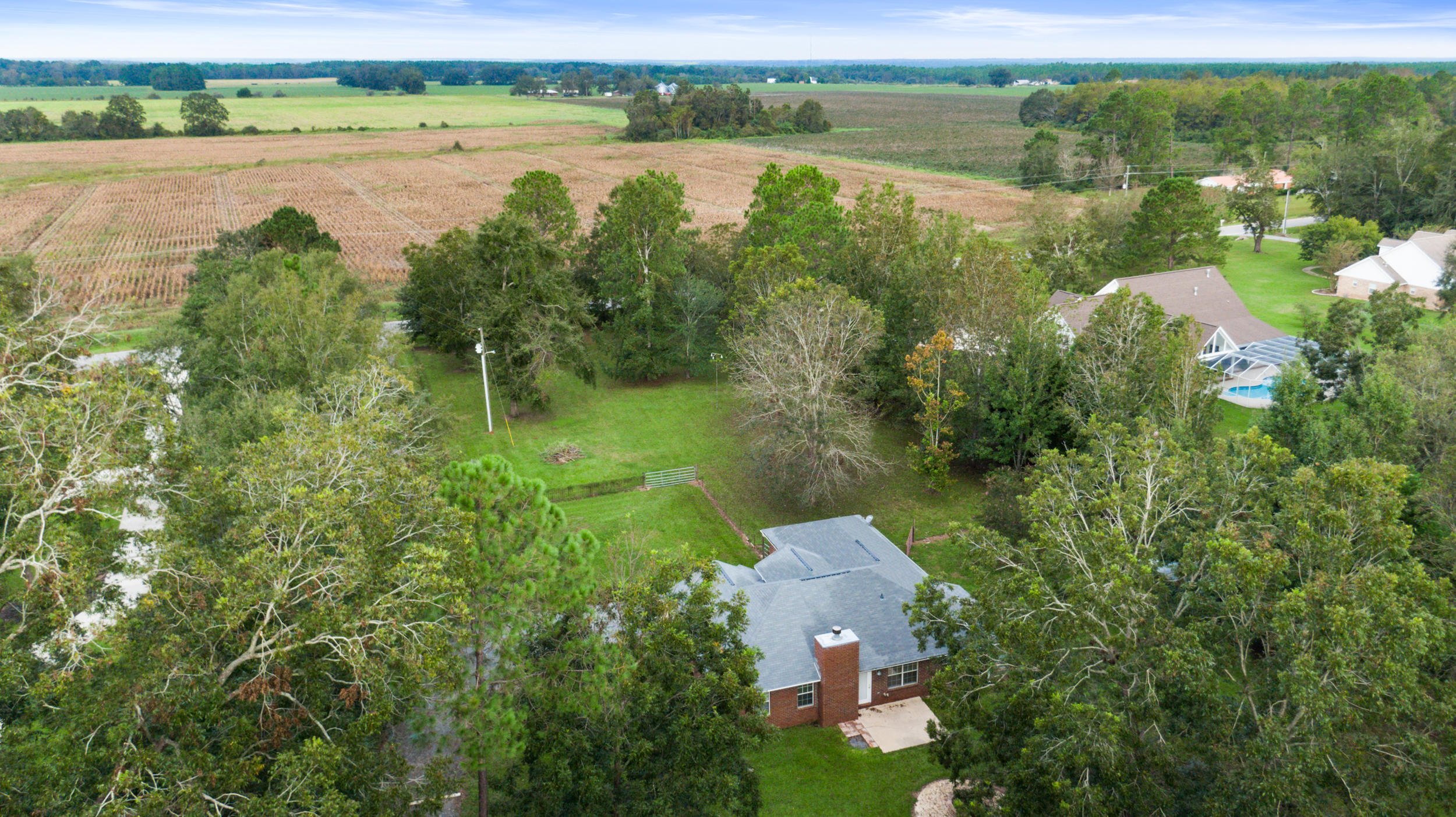 5975 Jack Stokes Road Baker, FL 32531 - Photo 33 of 44 an aerial view of a houses with outdoor space and lake view