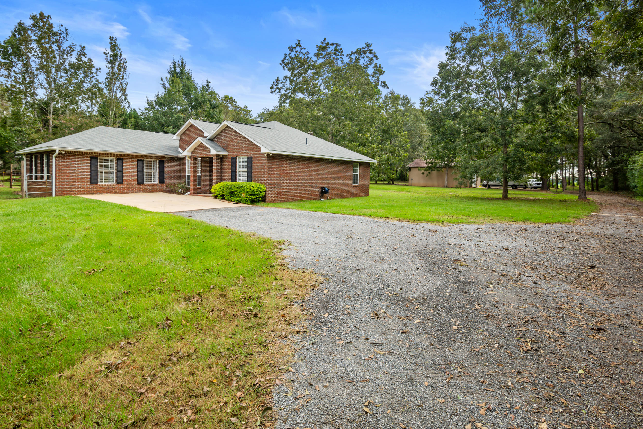 5975 Jack Stokes Road Baker, FL 32531 - Photo 35 of 44 a view of a house with a yard