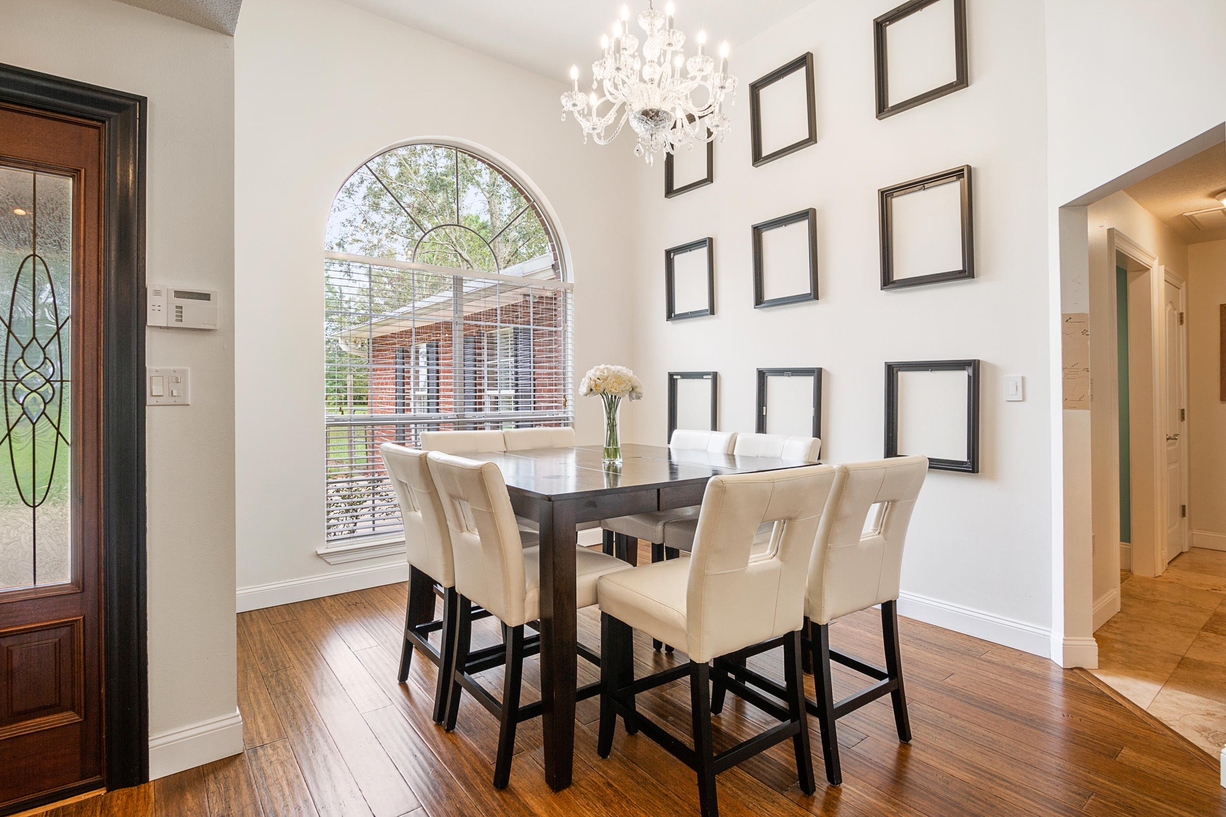 5975 Jack Stokes Road Baker, FL 32531 - Photo 7 of 44 a view of a dining room with furniture window and wooden floor
