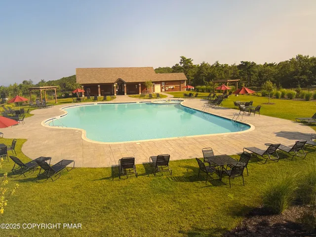 a view of a swimming pool with an ocean view