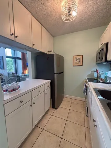 a kitchen with a cabinets and a stove