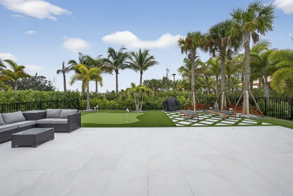 a view of a garden with palm trees