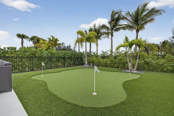 a view of a swimming pool with a yard