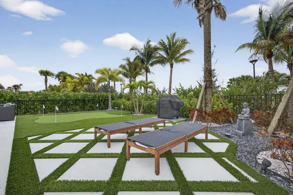 a view of a backyard with a patio