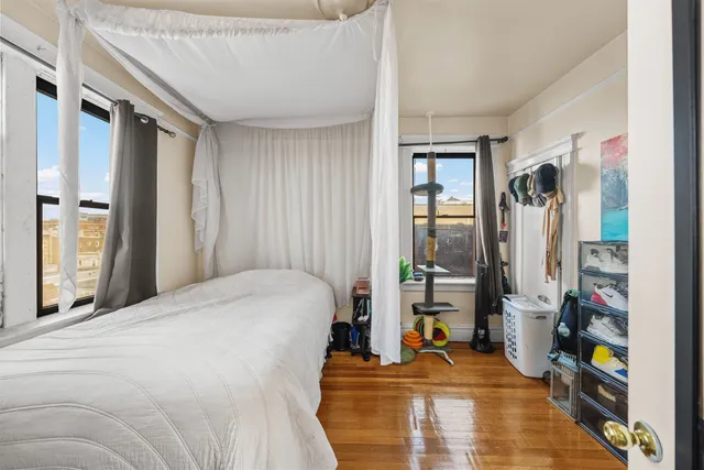 a bedroom with a bed furniture and a window