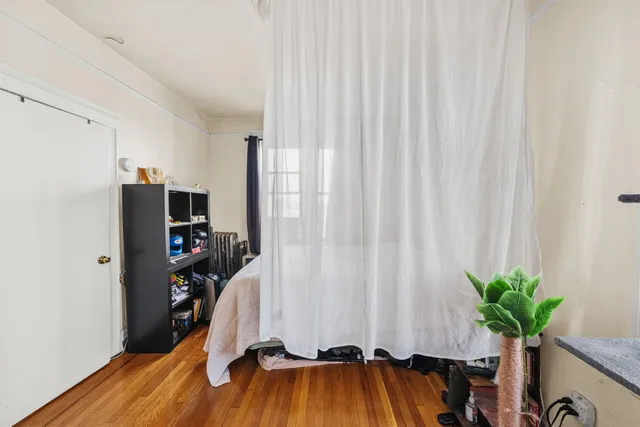 a view of a room with toys and wooden floor