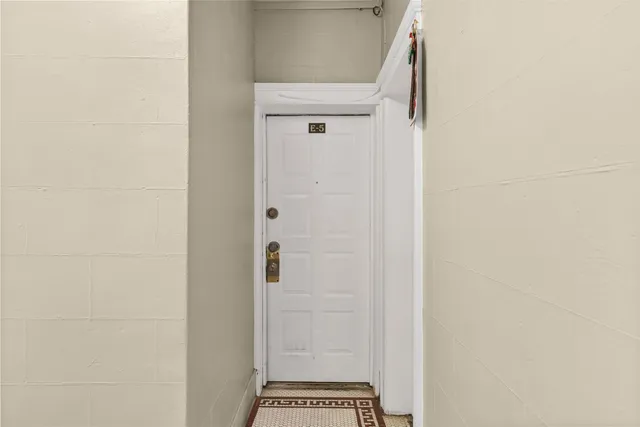 a view of a brick building with many windows