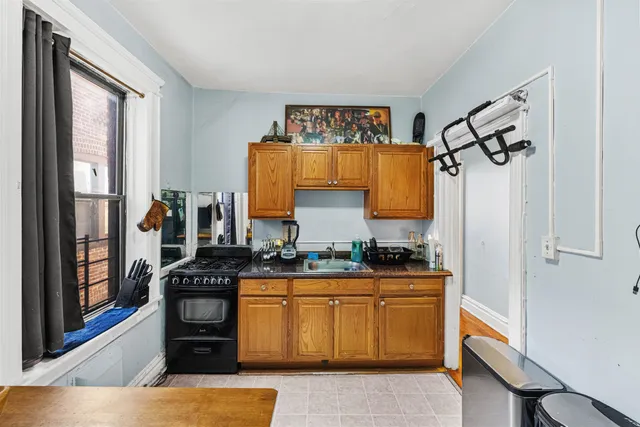 a kitchen with stainless steel appliances granite countertop a stove and a sink