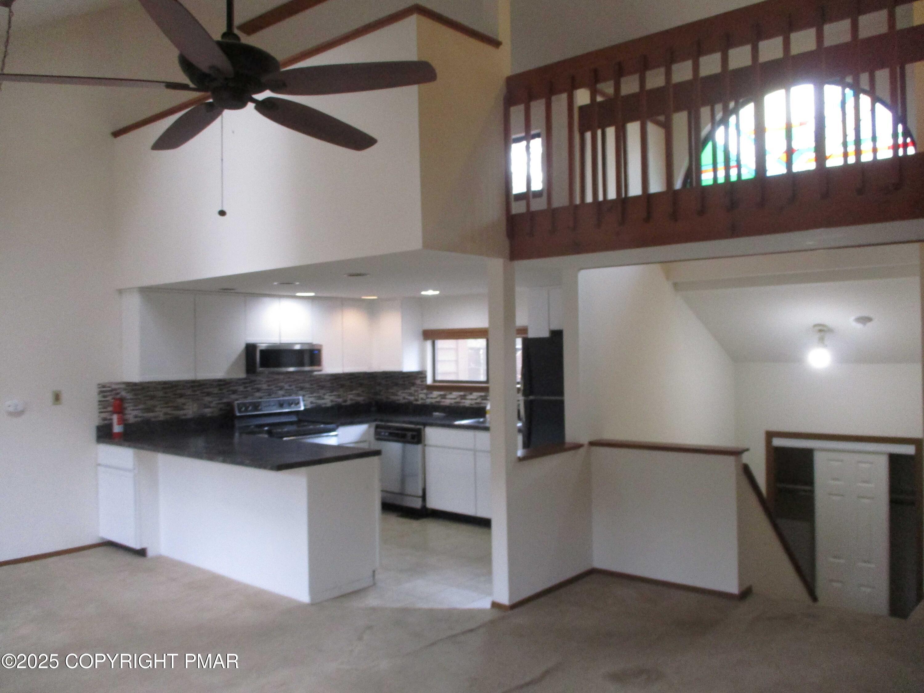 159 Stream Court Bushkill, PA 18324 - Photo 6 of 26 a kitchen with stainless steel appliances granite countertop a stove and a sink