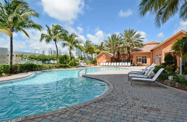 a view of outdoor space with swimming pool and lounge chair
