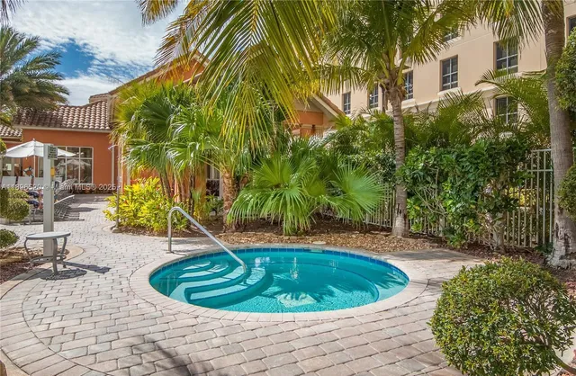 a view of a swimming pool with sitting area
