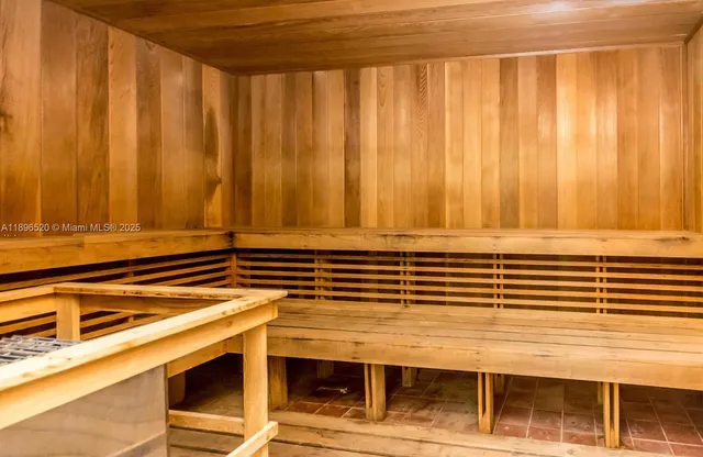 a view of a room with wooden walls and stairs