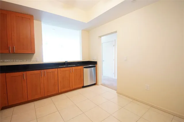 a view of an empty room and wooden floor