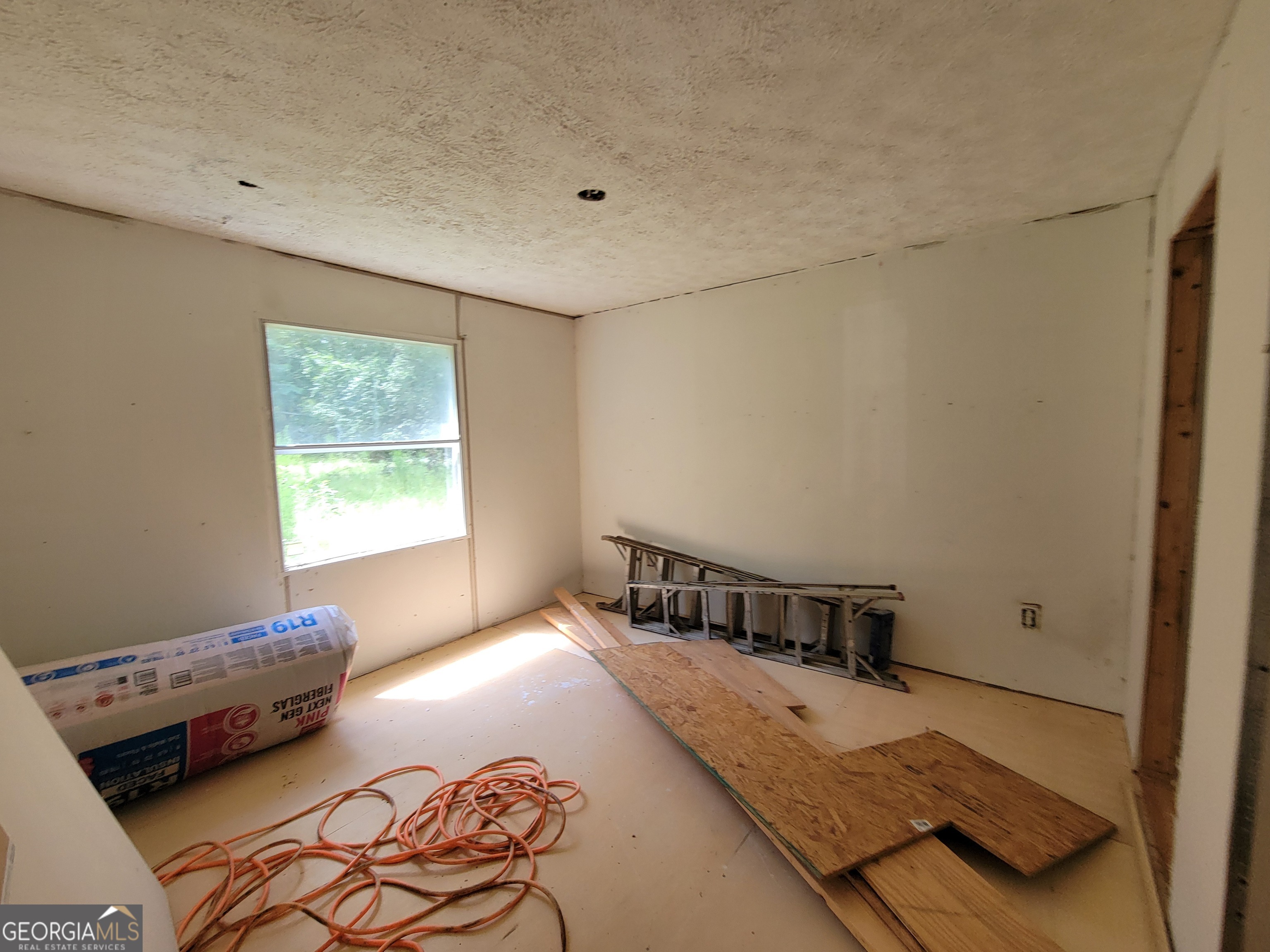 11358 Zebina Road Louisville, GA 30434 - Photo 15 of 22 a bedroom with a bed and a window