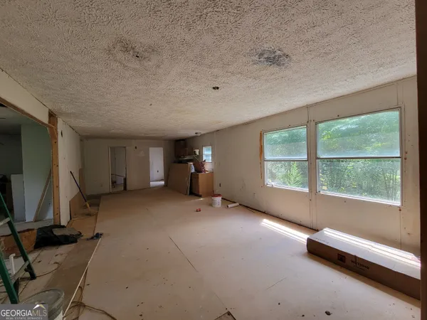 a living room with furniture and a table