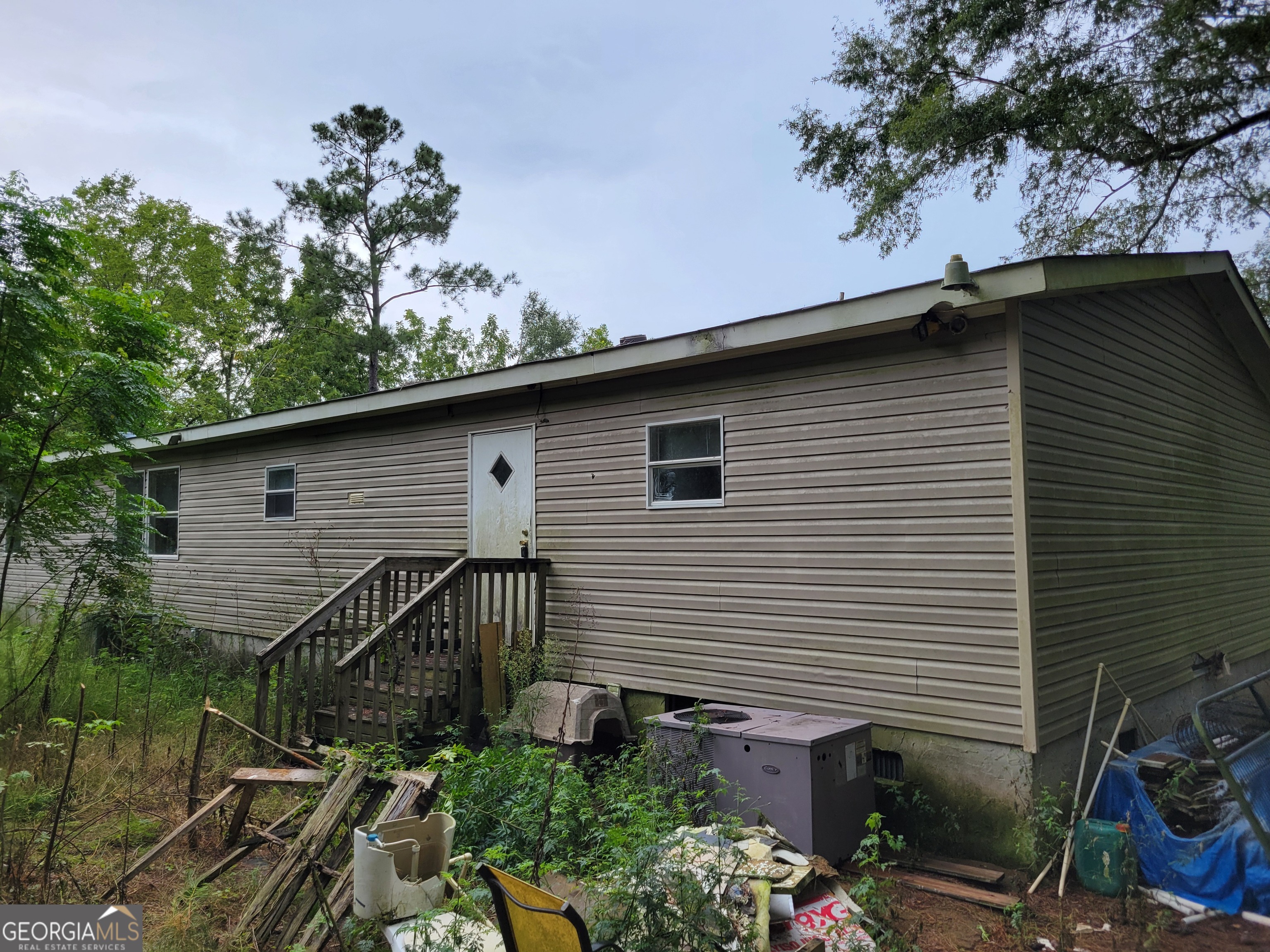 11358 Zebina Road Louisville, GA 30434 - Photo 2 of 22 a backyard of a house with lots of green space