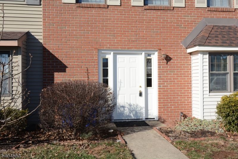 129 Hampton Court Somerset, NJ 08873 - Photo 2 of 25 a front view of a house with a garden