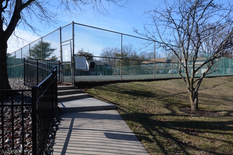 129 Hampton Court Somerset, NJ 08873 - Photo 23 of 25 a view of a yard with wooden fence