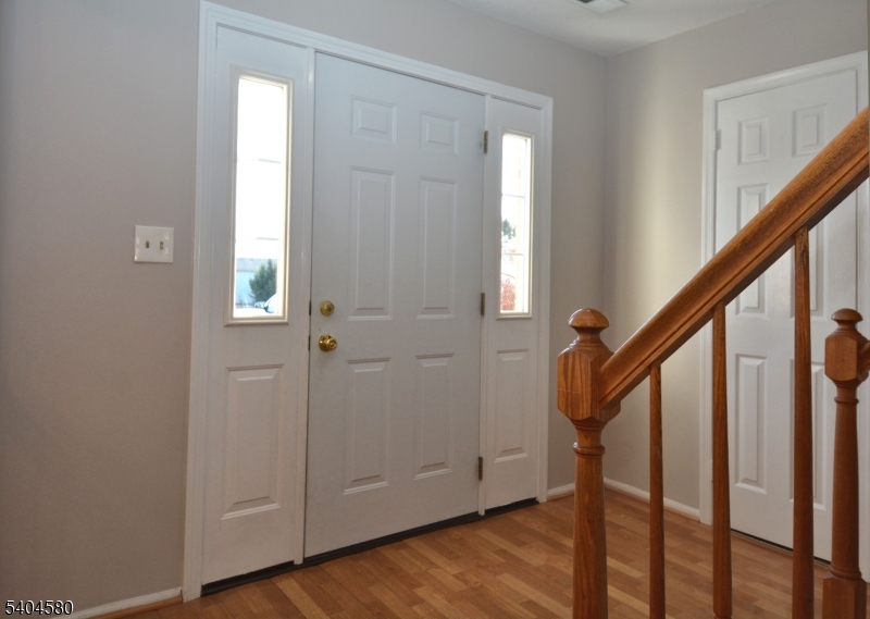 129 Hampton Court Somerset, NJ 08873 - Photo 3 of 25 a view of an entryway with wooden floor and stairs