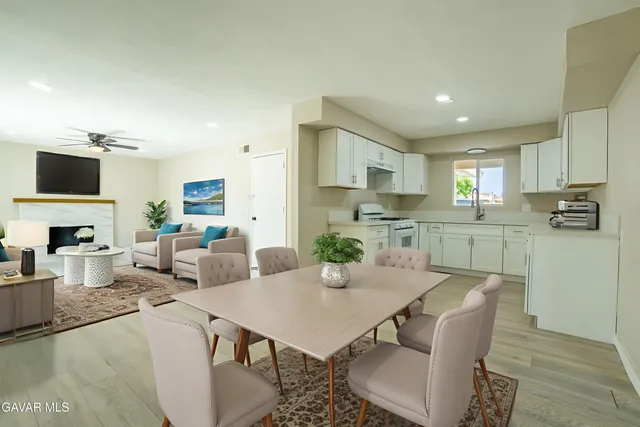 a view of kitchen with dining table and chairs