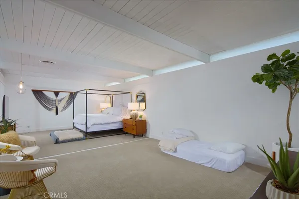 a bathroom with a sink and mirror with toilet