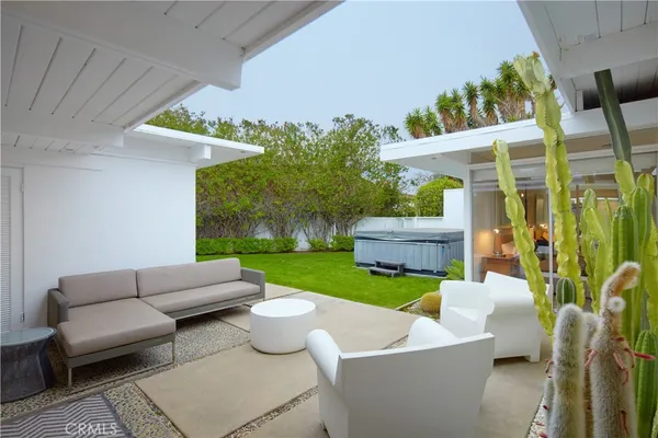 a living room filled with furniture and a garden