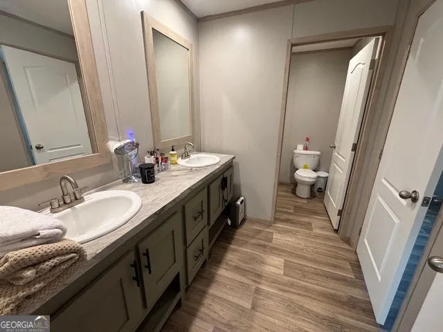 a spacious bathroom with a double vanity sink and a mirror