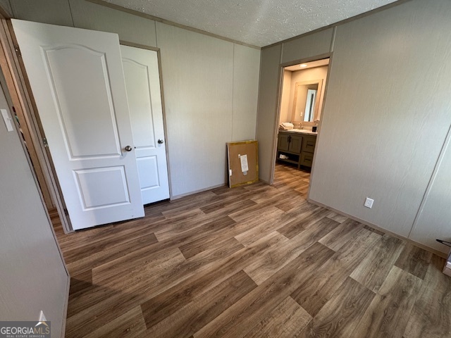 2470 Kitchen Road Dexter, GA 31019 - Photo 12 of 30 an empty room with wooden floor and closet