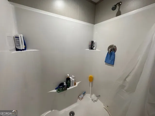 a bathroom with a sink and mirror