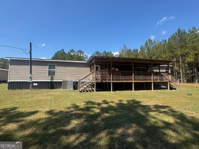 2470 Kitchen Road Dexter, GA 31019 - Photo 2 of 30 a view of an house with backyard space and balcony