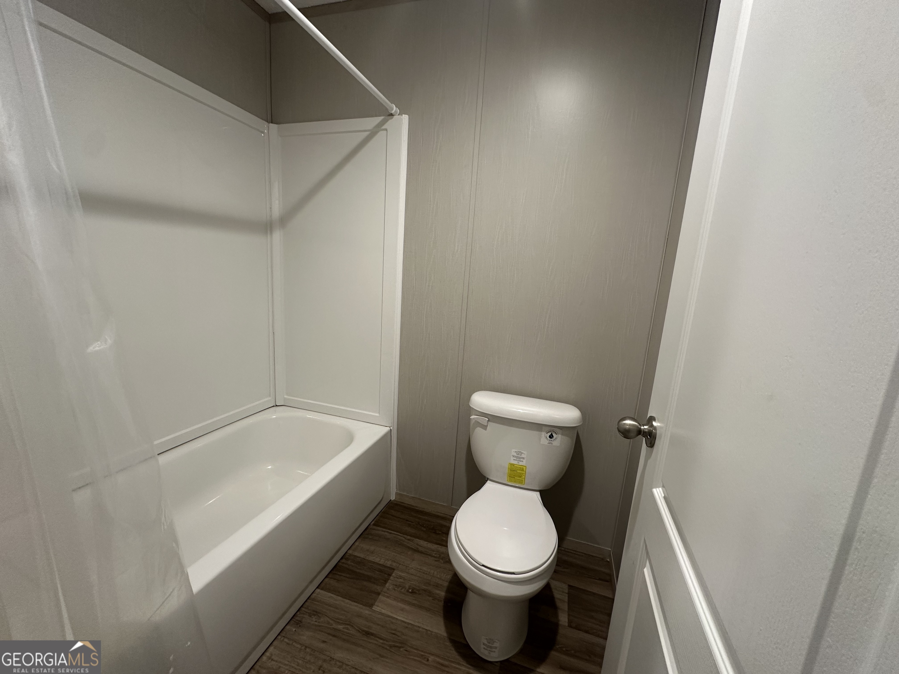 2470 Kitchen Road Dexter, GA 31019 - Photo 30 of 56 a white toilet sitting next to a bath tub