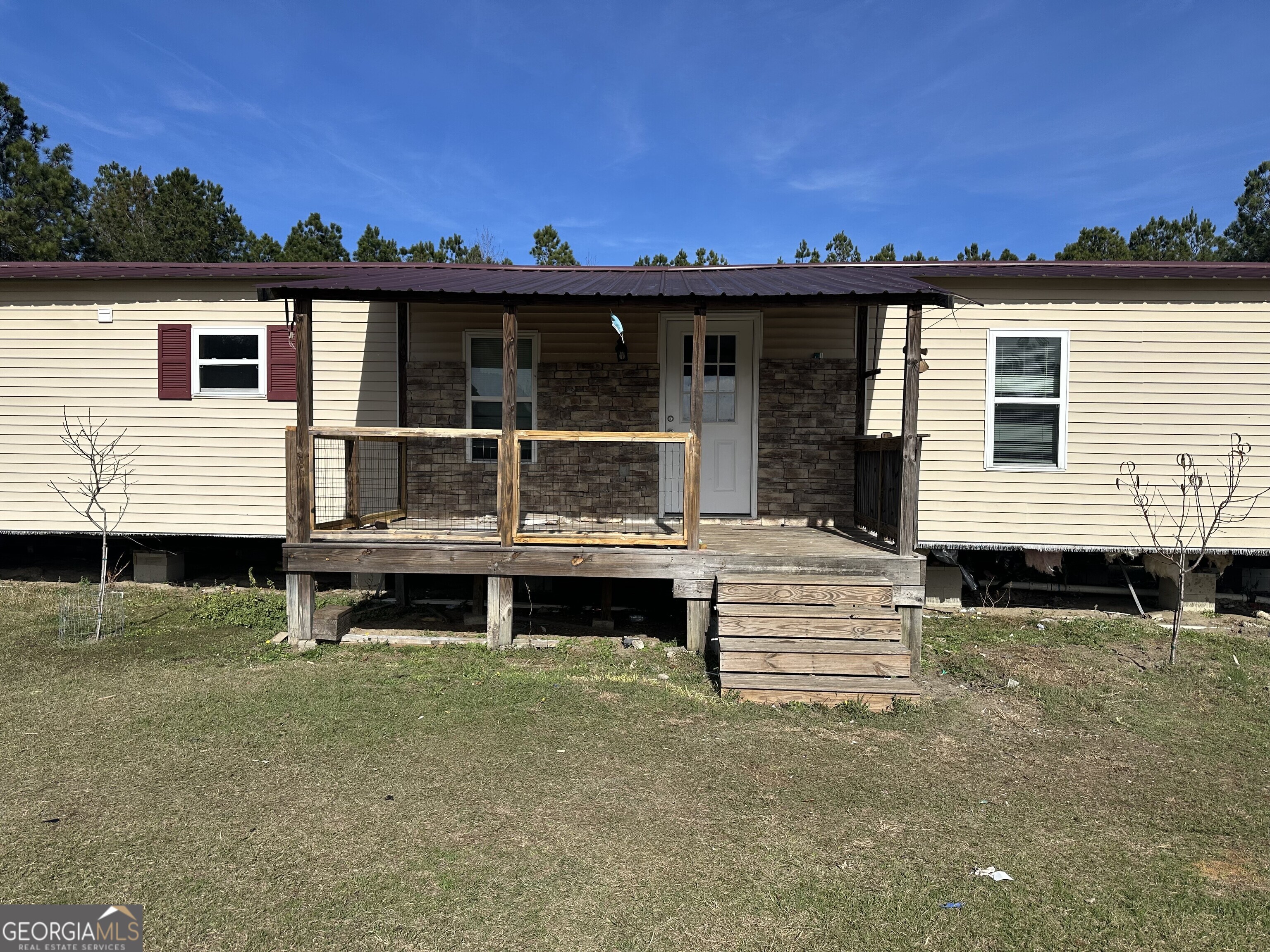 2470 Kitchen Road Dexter, GA 31019 - Photo 44 of 56 front view of a house with a balcony