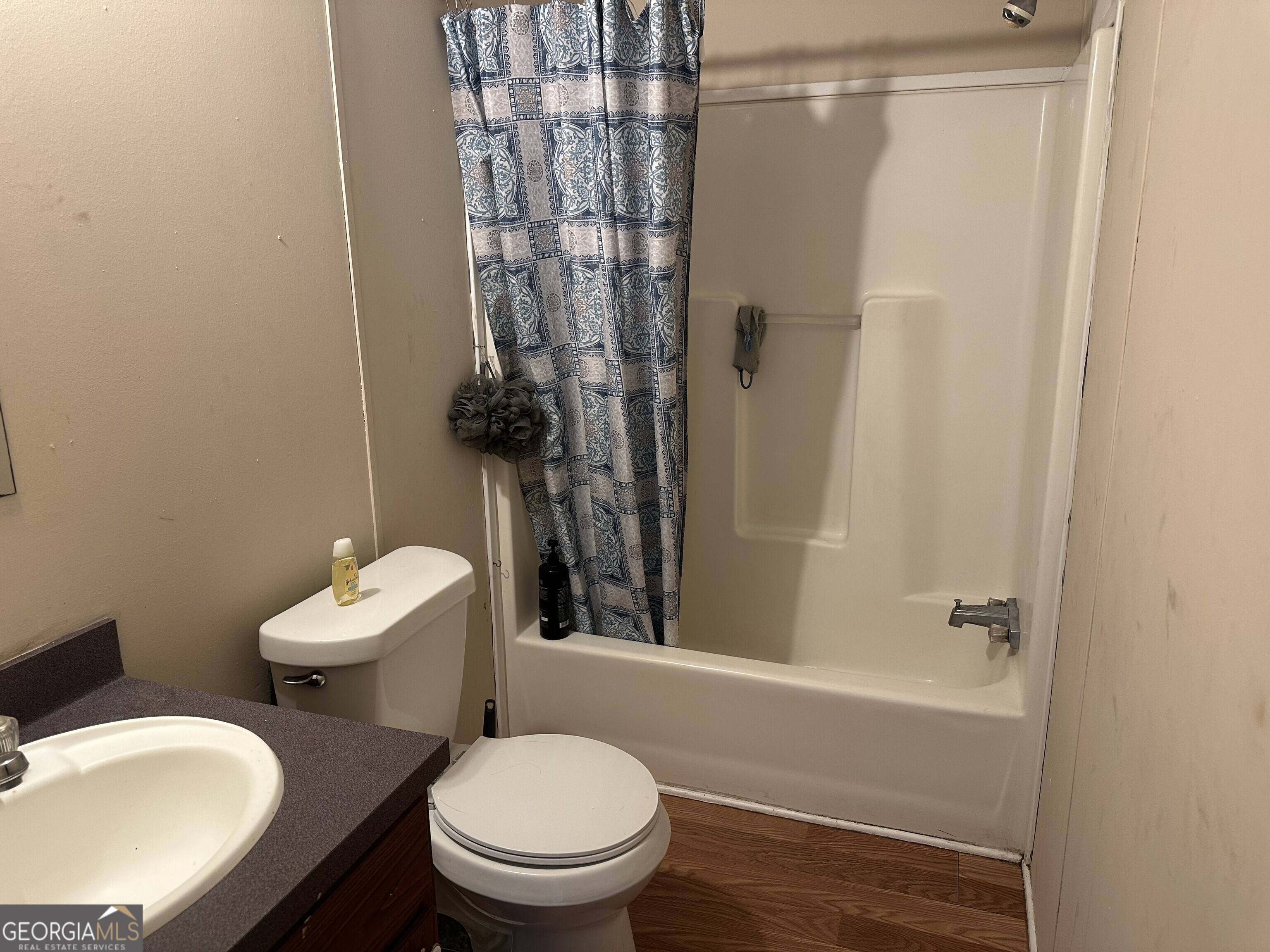 2470 Kitchen Road Dexter, GA 31019 - Photo 47 of 56 a white toilet sitting next to a bath tub