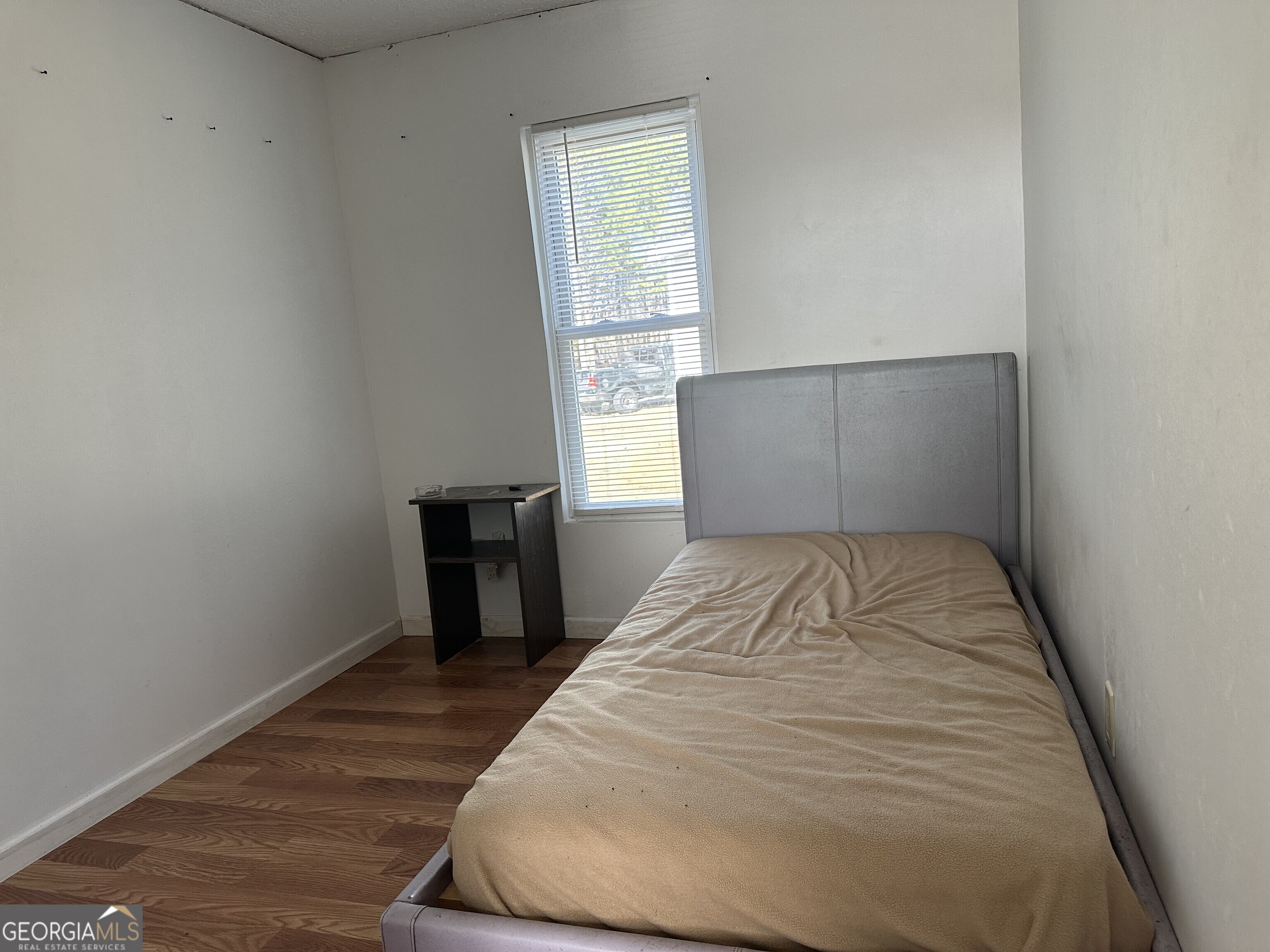 2470 Kitchen Road Dexter, GA 31019 - Photo 48 of 56 a bedroom with a bed and a window