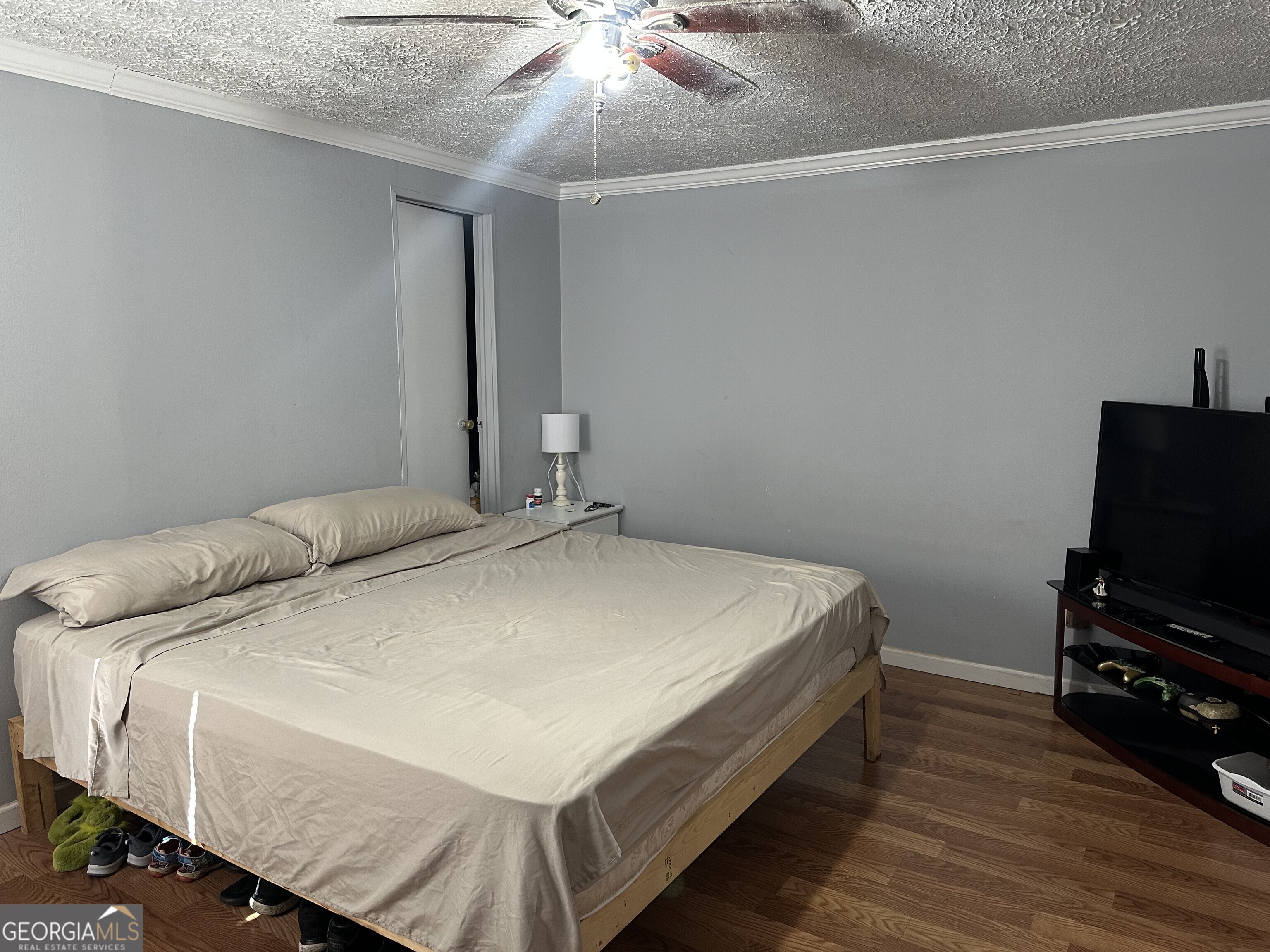 2470 Kitchen Road Dexter, GA 31019 - Photo 53 of 56 a bedroom with a bed and a flat screen tv