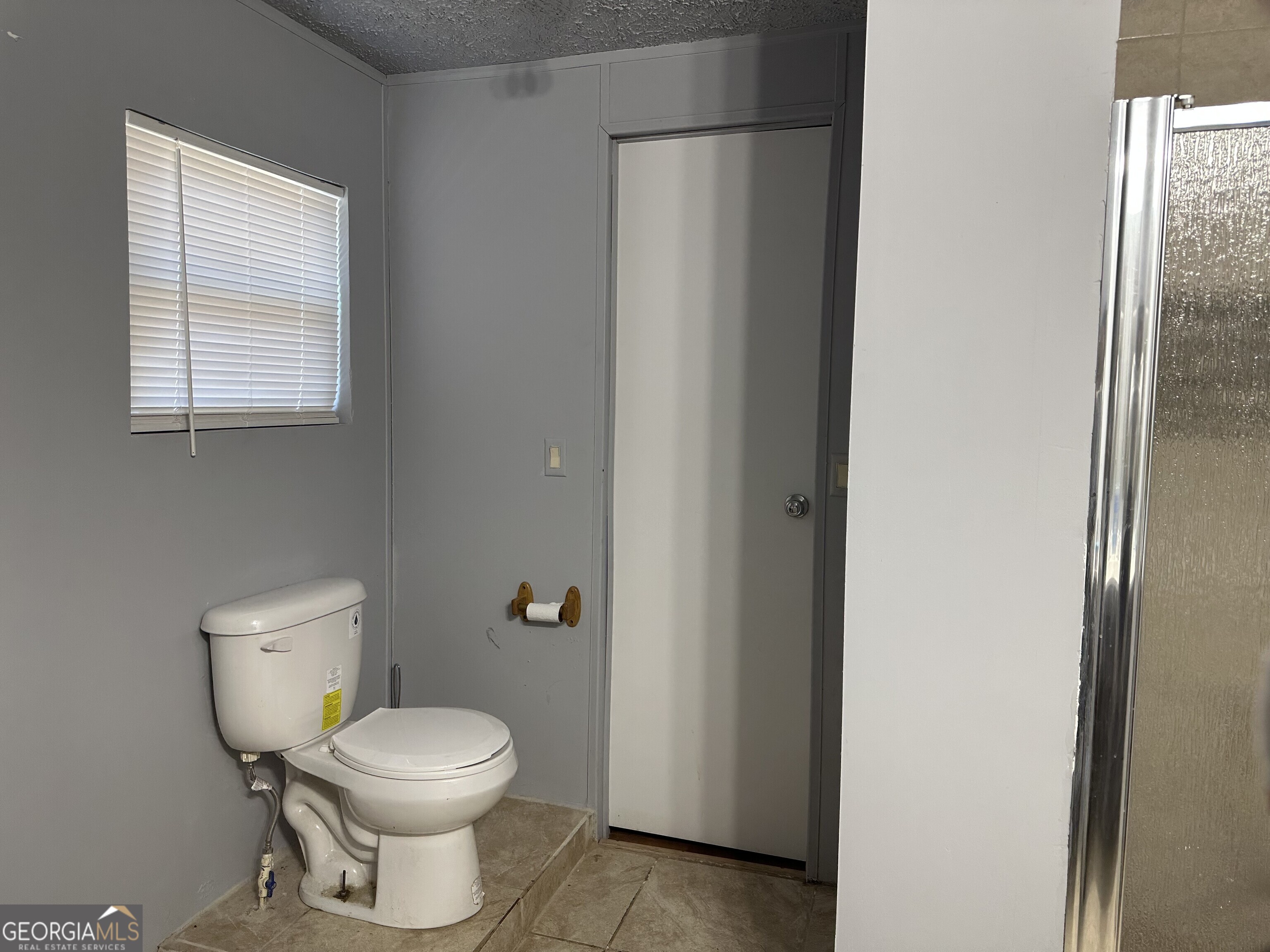 2470 Kitchen Road Dexter, GA 31019 - Photo 56 of 56 a white toilet sitting next to a bathroom sink