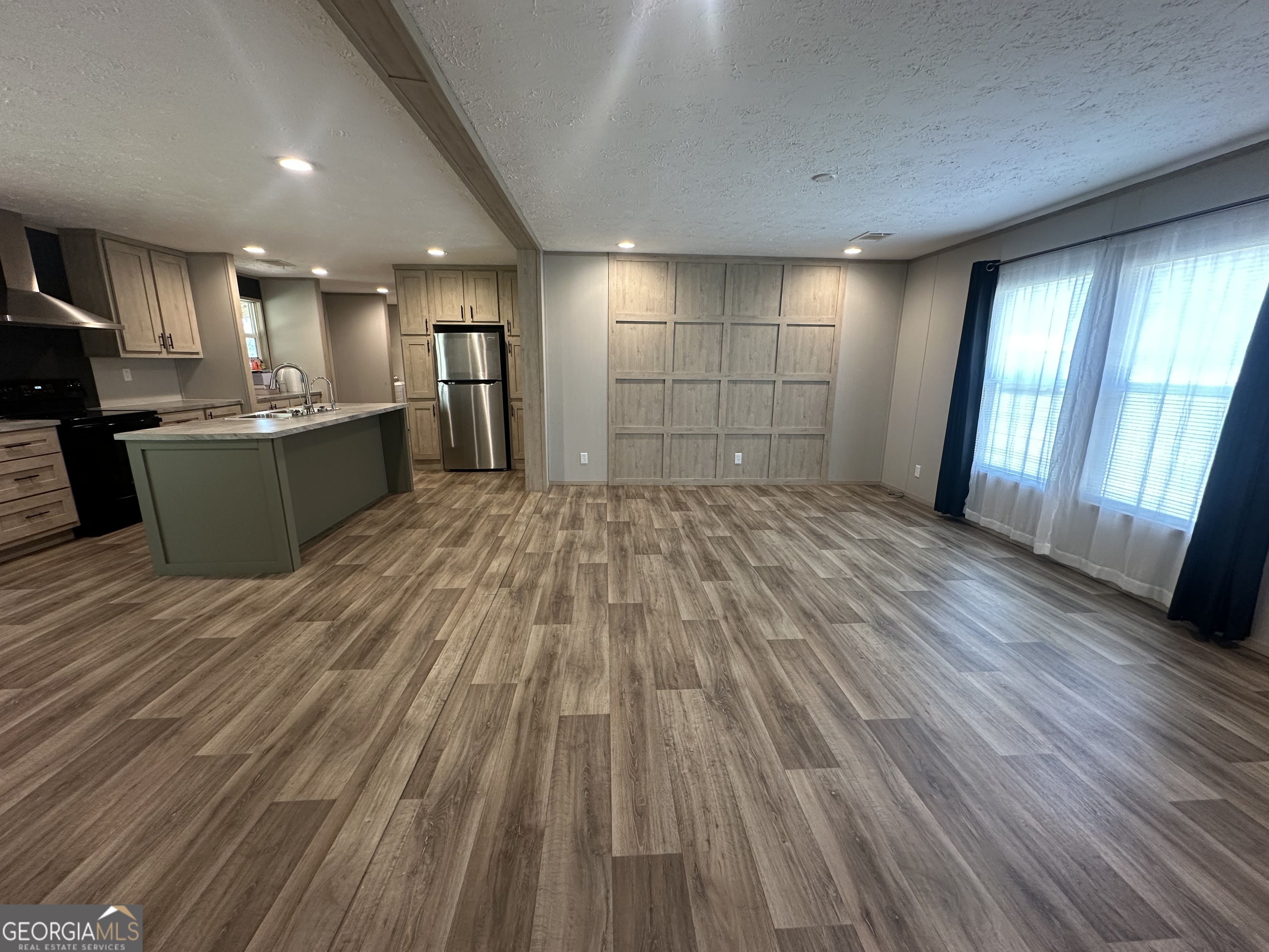 2470 Kitchen Road Dexter, GA 31019 - Photo 6 of 56 a view of a room with wooden floor and stairs