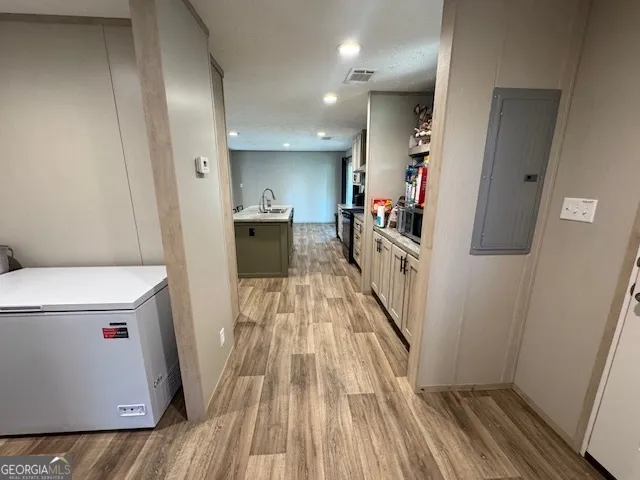 a view of a kitchen from the hallway