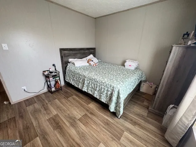 a bedroom with a bed and a mirror