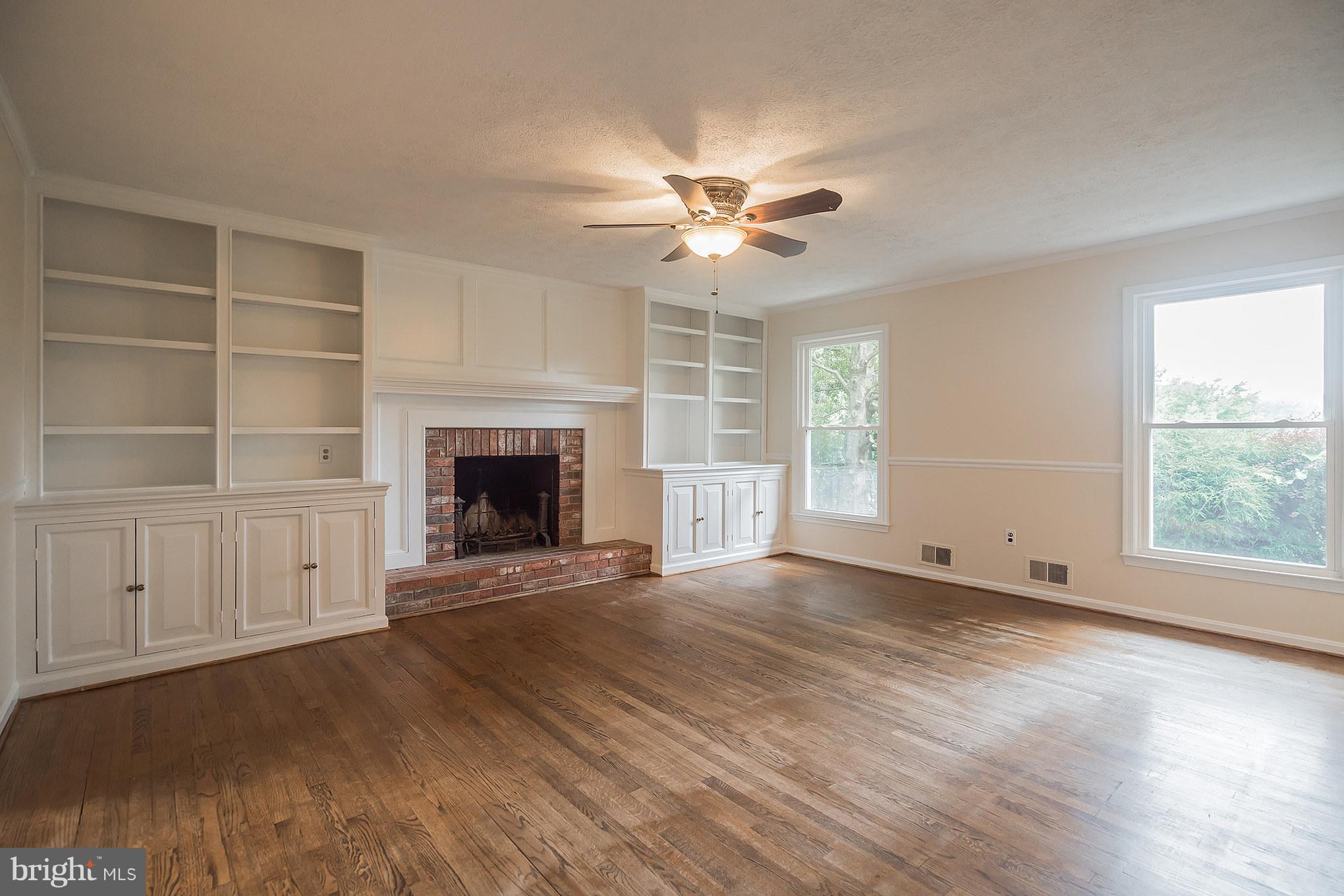 9448 Lovat Road Fulton, MD 20759 - Photo 14 of 30 an empty room with windows fireplace and a sink