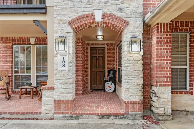 a front view of a building with a lots of shower doors