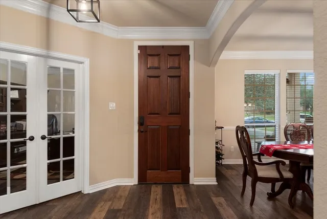 an outdoor space with furniture and wooden floor