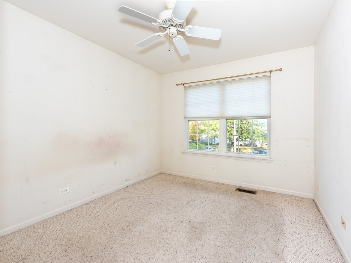 3110 Crystal Rock Road Naperville, IL 60564 - Photo 16 of 27 an empty room with windows and ceiling fan