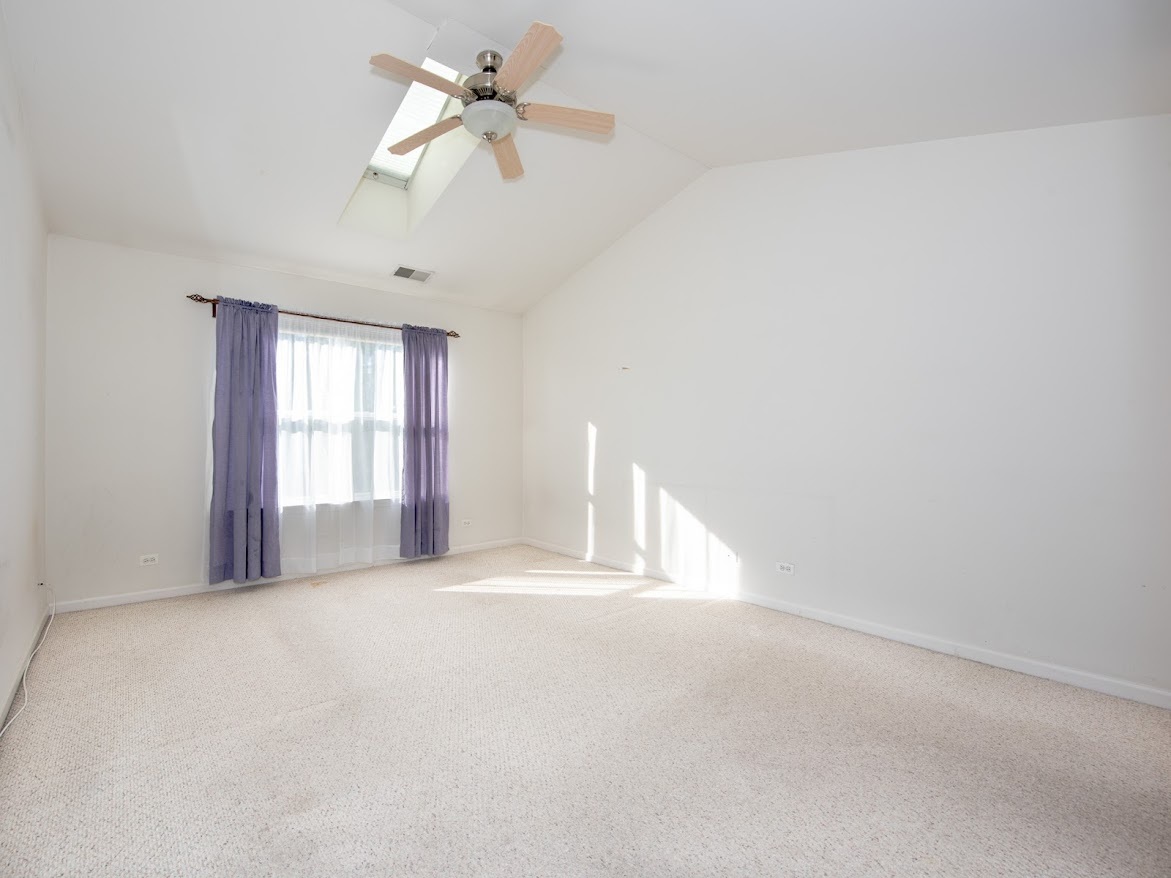 3110 Crystal Rock Road Naperville, IL 60564 - Photo 18 of 27 a view of an empty room with a window