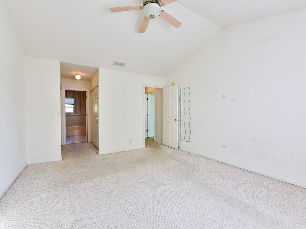 3110 Crystal Rock Road Naperville, IL 60564 - Photo 19 of 27 an empty room with a ceiling fan and a window